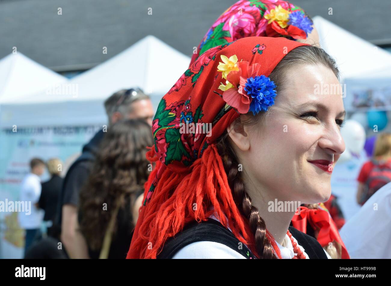 LONDON  ENGLAND 9 May 2015: Pretty Polish woman in traditional head scarf Stock Photo