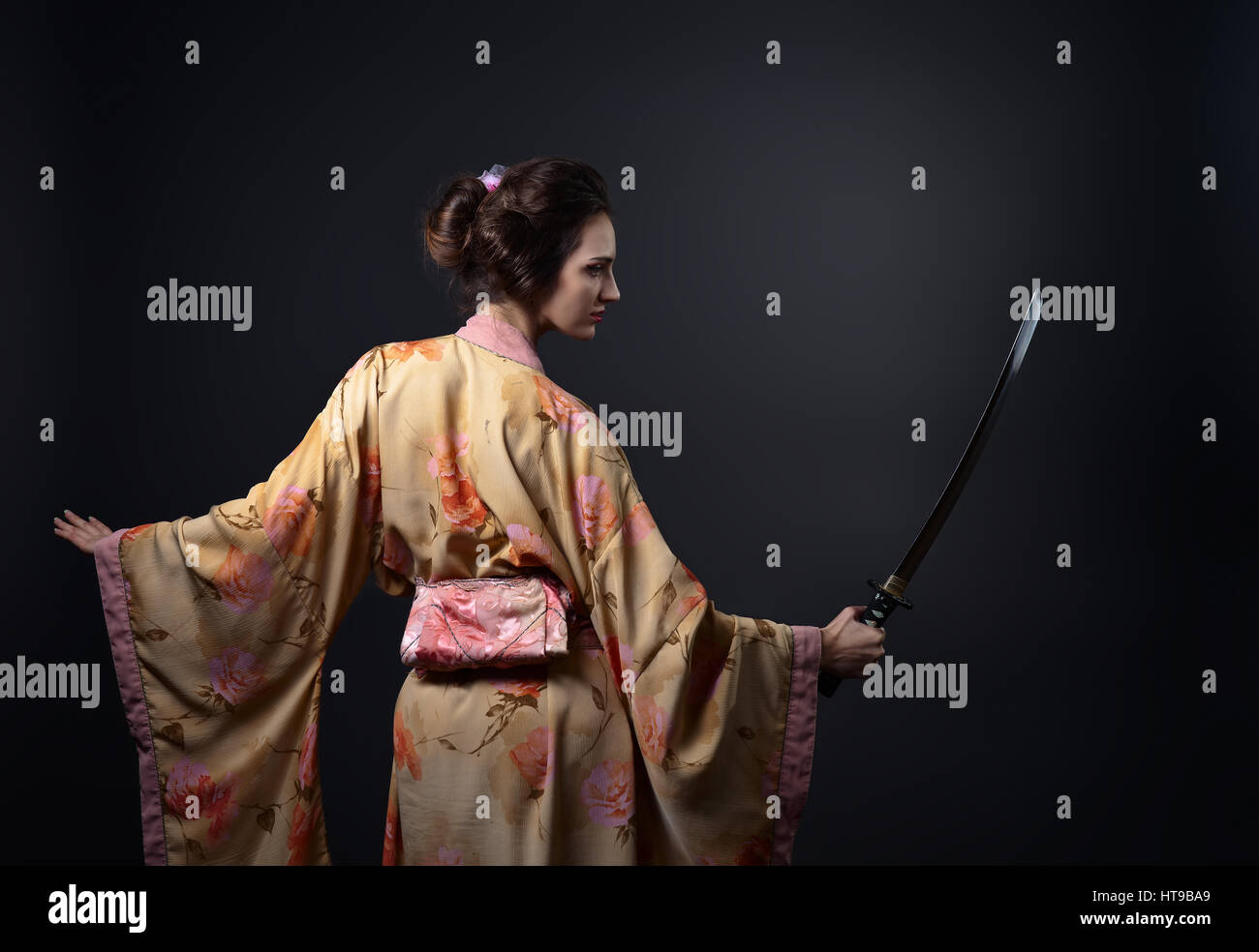 young beautiful woman in traditional Japanese kimono with katana Stock  Photo - Alamy
