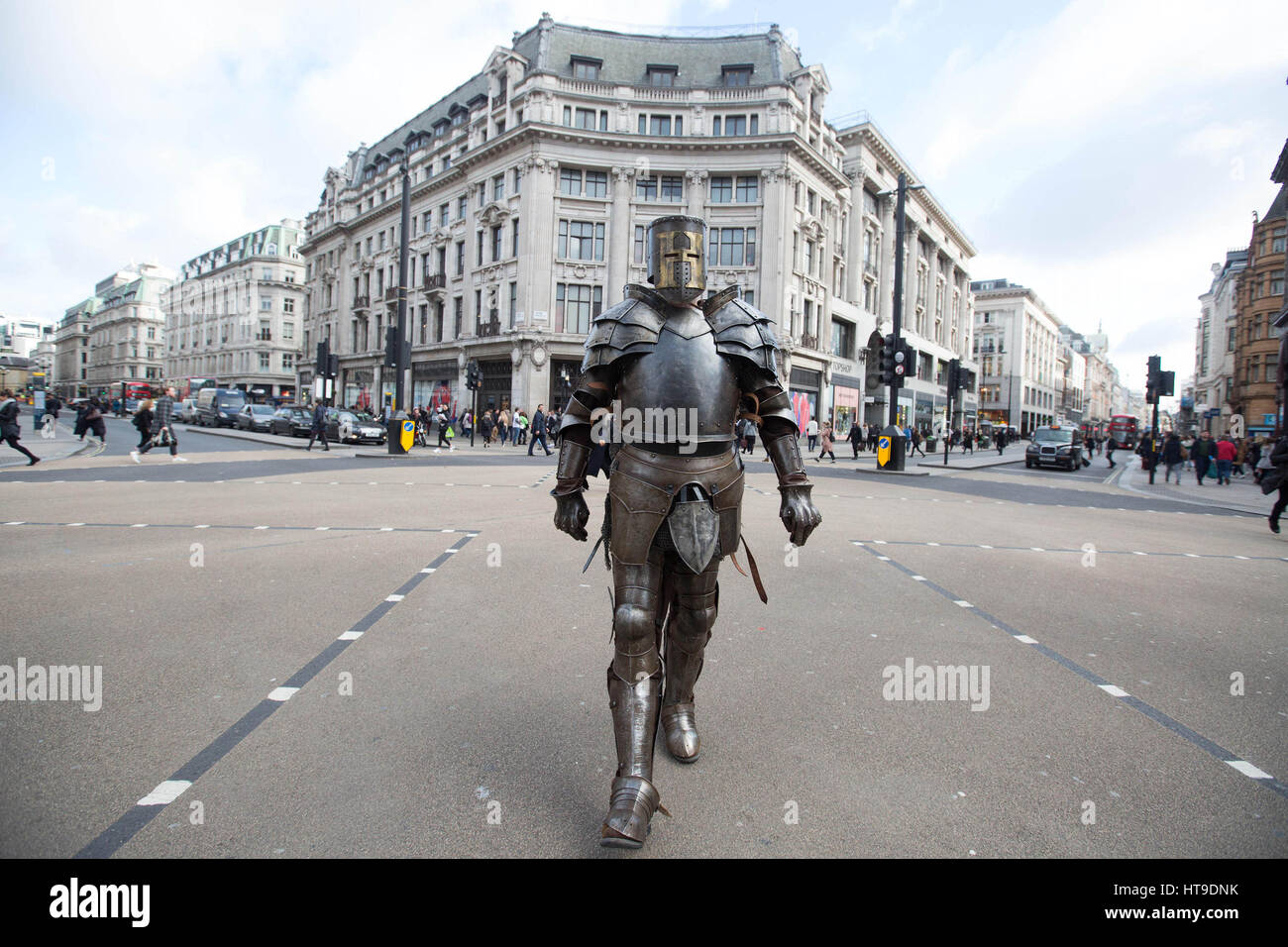 PABest EDITORIAL USE ONLY A seven foot man dressed as a Knight in armour in Oxford Circus, London today as part of the HISTORY's A Big Knight In, which continues tonight with a new episode of Forged in Fire at 9pm. Stock Photo