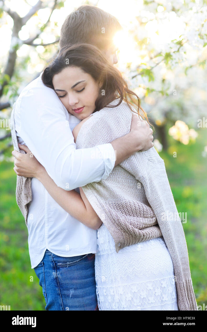 Young couple in love kissing and hugging in nature Stock Photo - Alamy