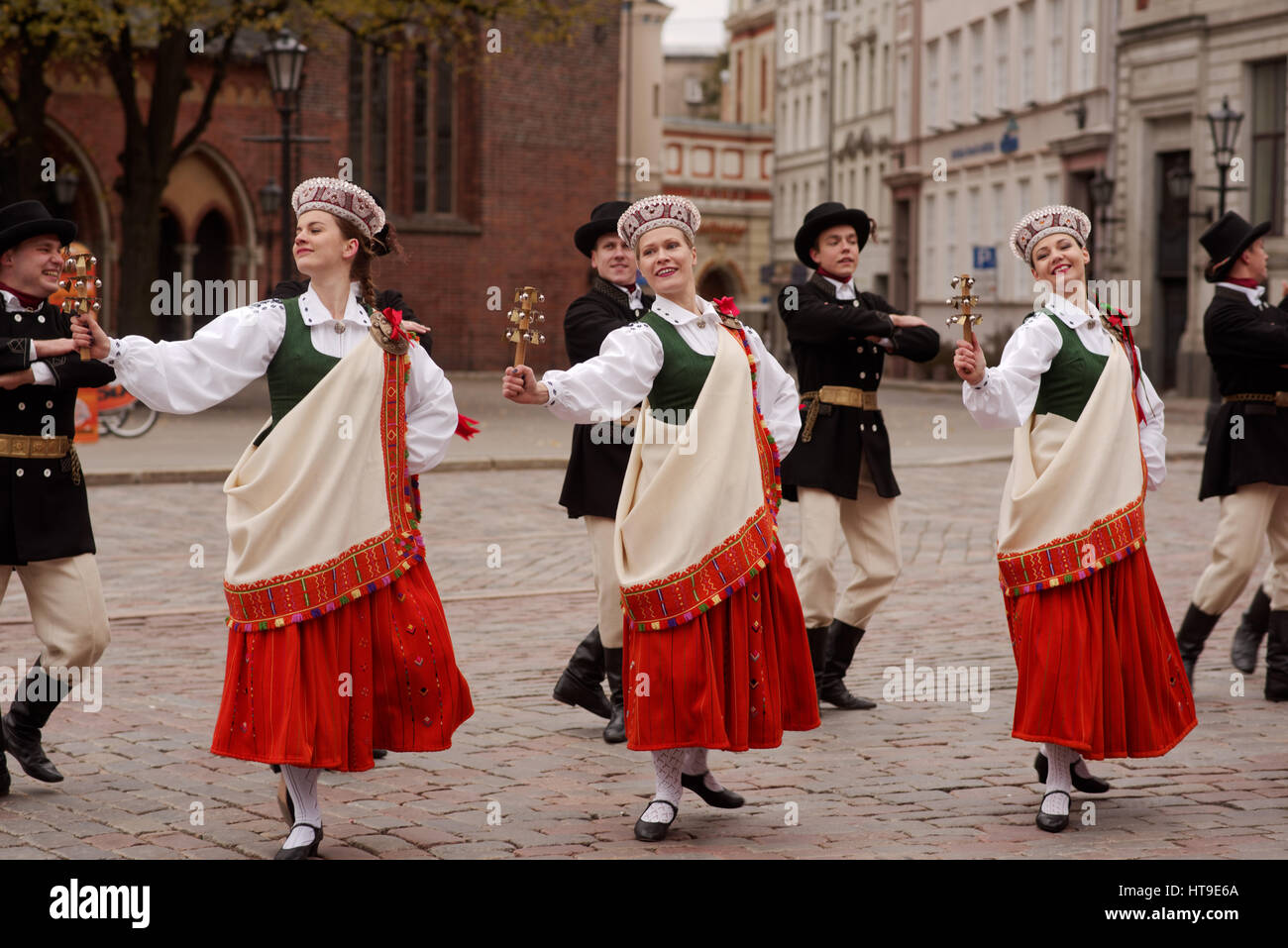 Dancers in national costumes performs on the Dome square in Riga, Latvia Stock Photo