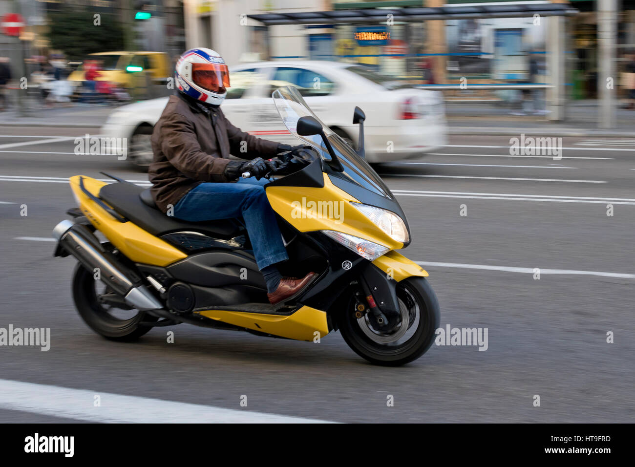 One person riding a yellow Yamaha T-Max motorcycle in Madrid city (Spain)  2017 Stock Photo - Alamy