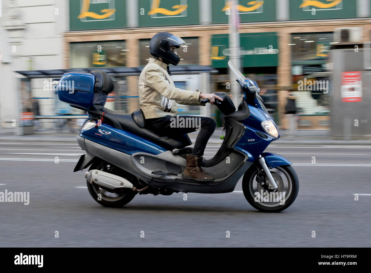 One person riding a blue Piaggio x9 evolution 125 motorcycle in Madrid  (Spain) 2017 Stock Photo - Alamy