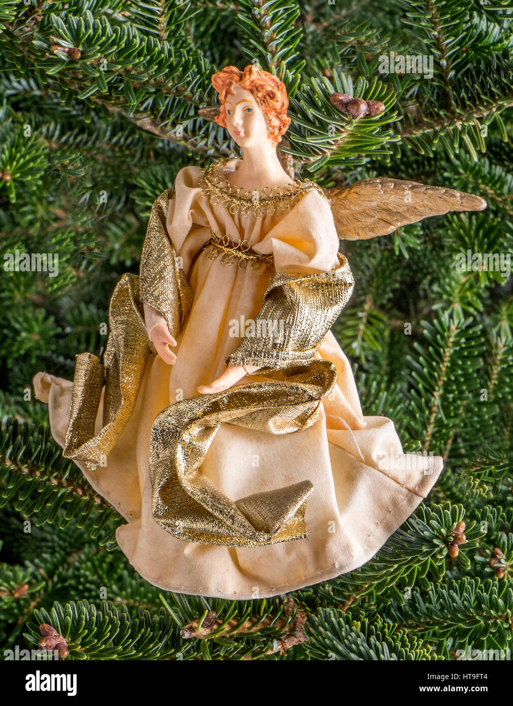Christmas bauble hanging from a tree in the shape of a Angel Stock Photo