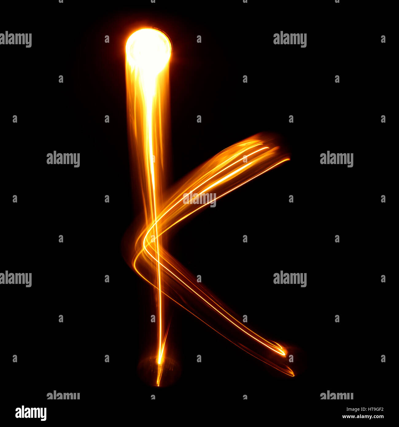 K - Created by light lowercase letters Stock Photo