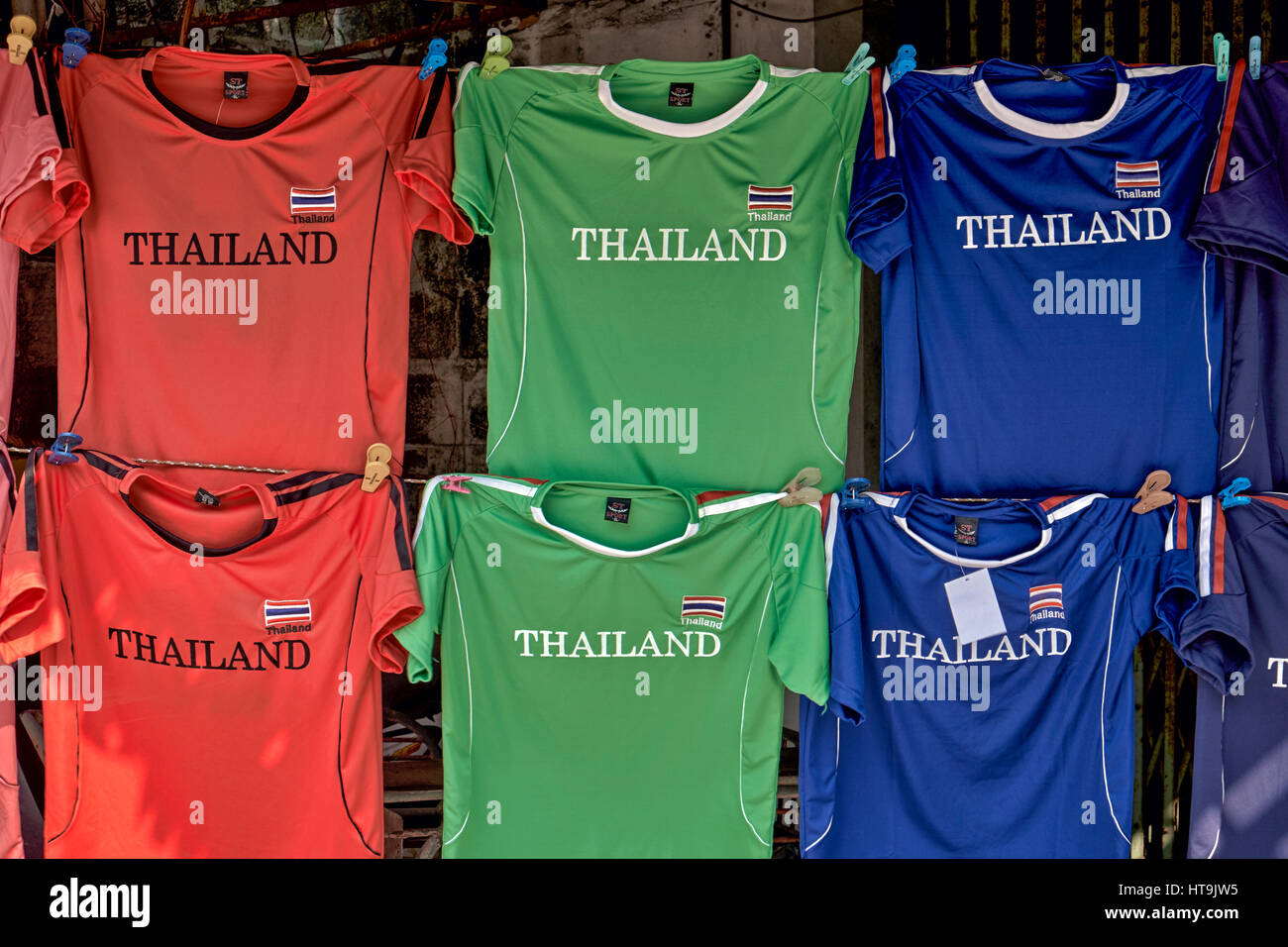 Football shirts for sale featuring the Thailand logo. Football shirt hanging. Stock Photo