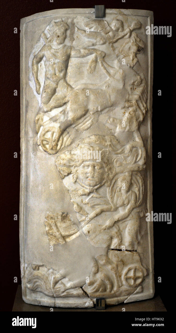 Fragment statue. Shield with the representation of the Sun (Helios) and the Moon (Selene). 1st-2nd century AD. Spain. Archaeological Museum. Tarragona. Catalonia, Spain. Stock Photo