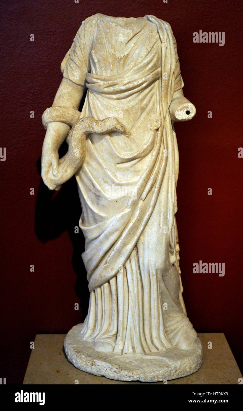 Hygieia feeding a large snake. Statue. Mid 2nd century. Reused in the thermal baths 4th century, frigidarium pool. Tarragona. National Archaeological Museum. Tarragona. Catalonia, Spain. Stock Photo