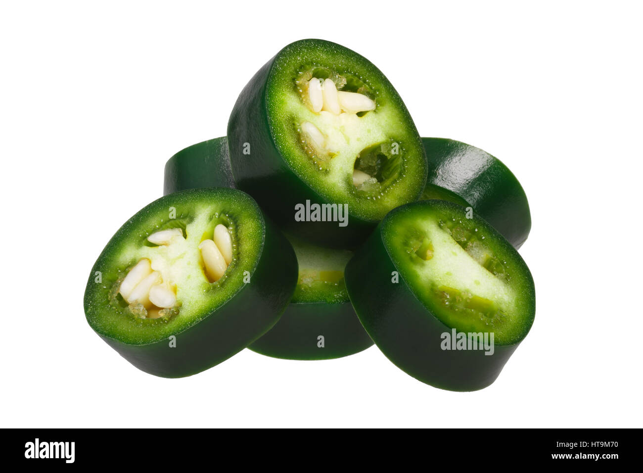 Sliced green Serrano pepper (Capsicum annuum). Clipping path, shadowless Stock Photo