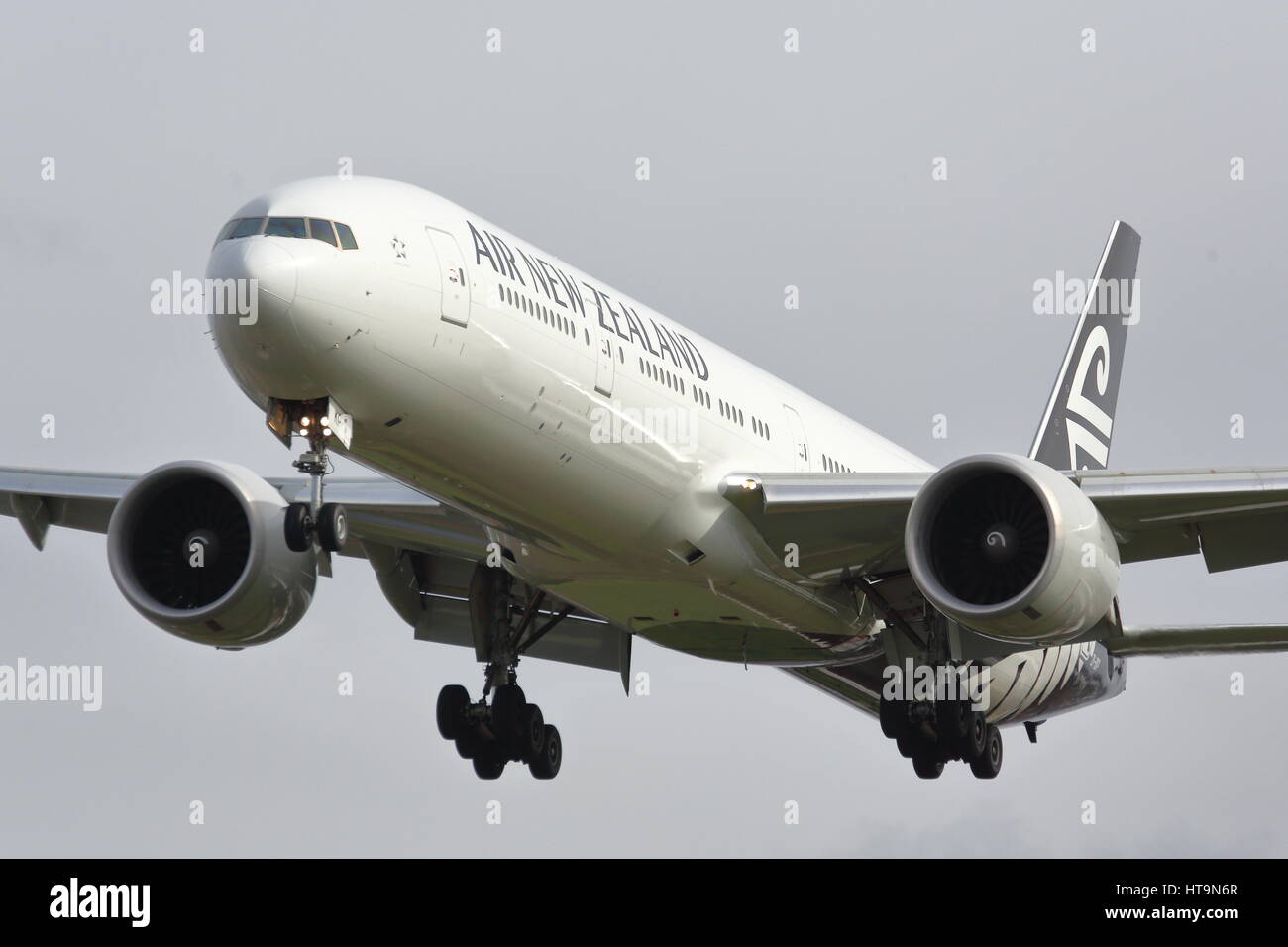 Air New Zealand Boeing 777-300 ZK-OKP landing at London Heathrow Airport, UK Stock Photo