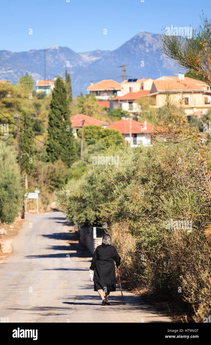 old lady in black, spartochori, Meganissi, Greece Stock Photo