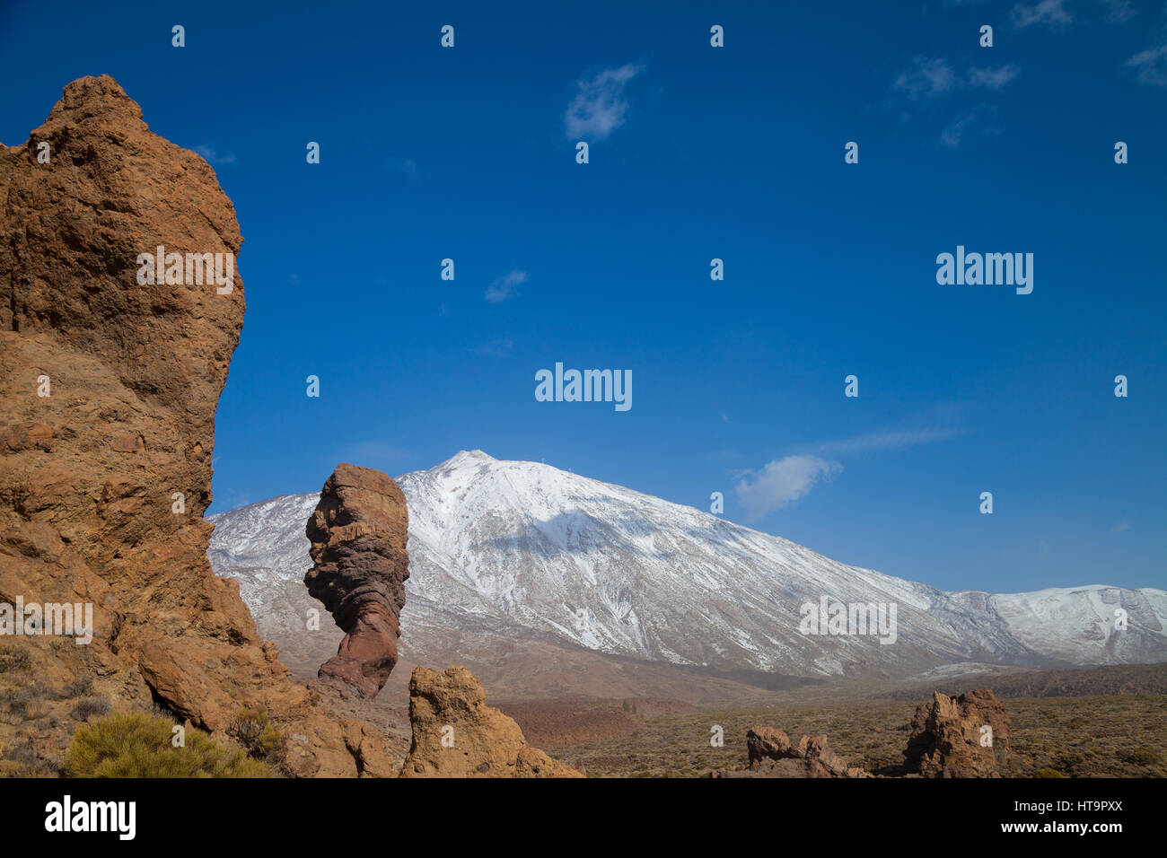 Looking towards the summit of El Teide Volcano on Tenerife with the Los Roques de Garcia in the foreground. Stock Photo