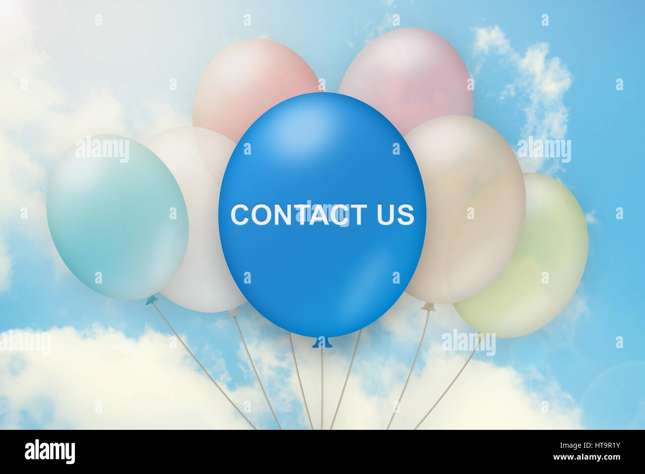 contact us on balloon with blue sky background Stock Photo