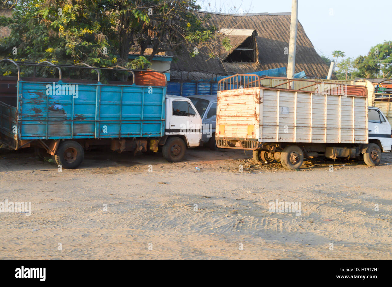 Two cattle trucks park along the Nairobi road to Mombasa in Kenya Stock Photo