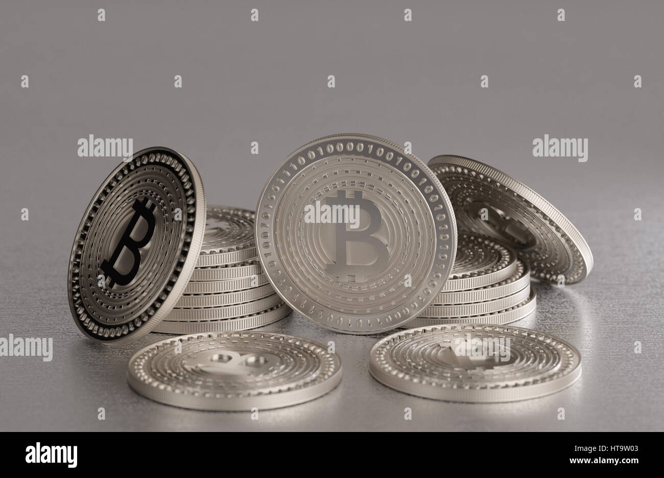 Stack of shiny silver bitcoins as example for blockchain and crypto  currency spread across a metal table Stock Photo - Alamy