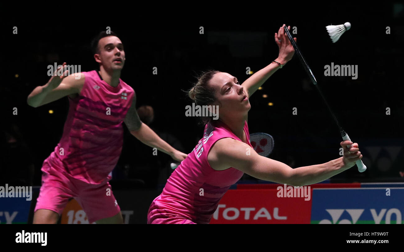 England's Chris Adcock (left) and Gabrielle Adcock in action during their Mixed doubles match during day three of the YONEX All England Open Badminton Championships at the Barclaycard Arena, Birmingham. Stock Photo