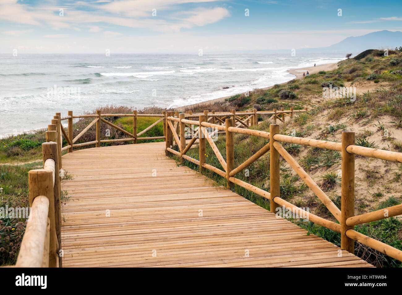 Woden walkway in natural park of Cabopino, Marbella, Costa del Sol, Málaga province, Andalusia, Spain Stock Photo