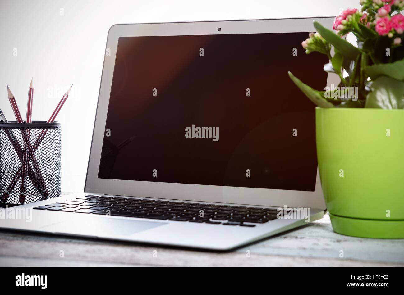 Laptop on desk in modern office mockup. Use for web design presentation Stock Photo