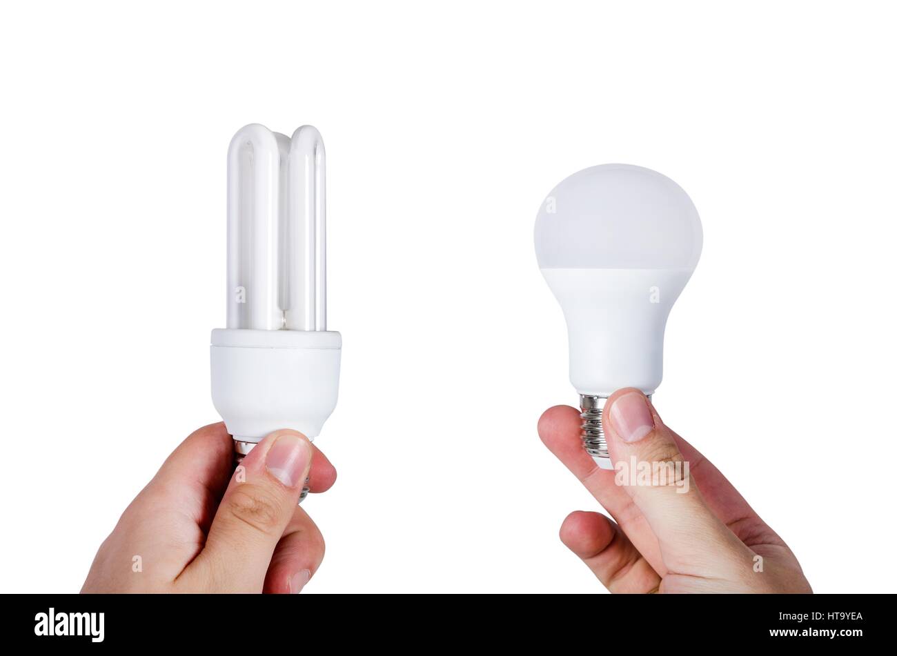 Compare two different types of bulbs. Energy saving lamp or LED choice. Stock Photo