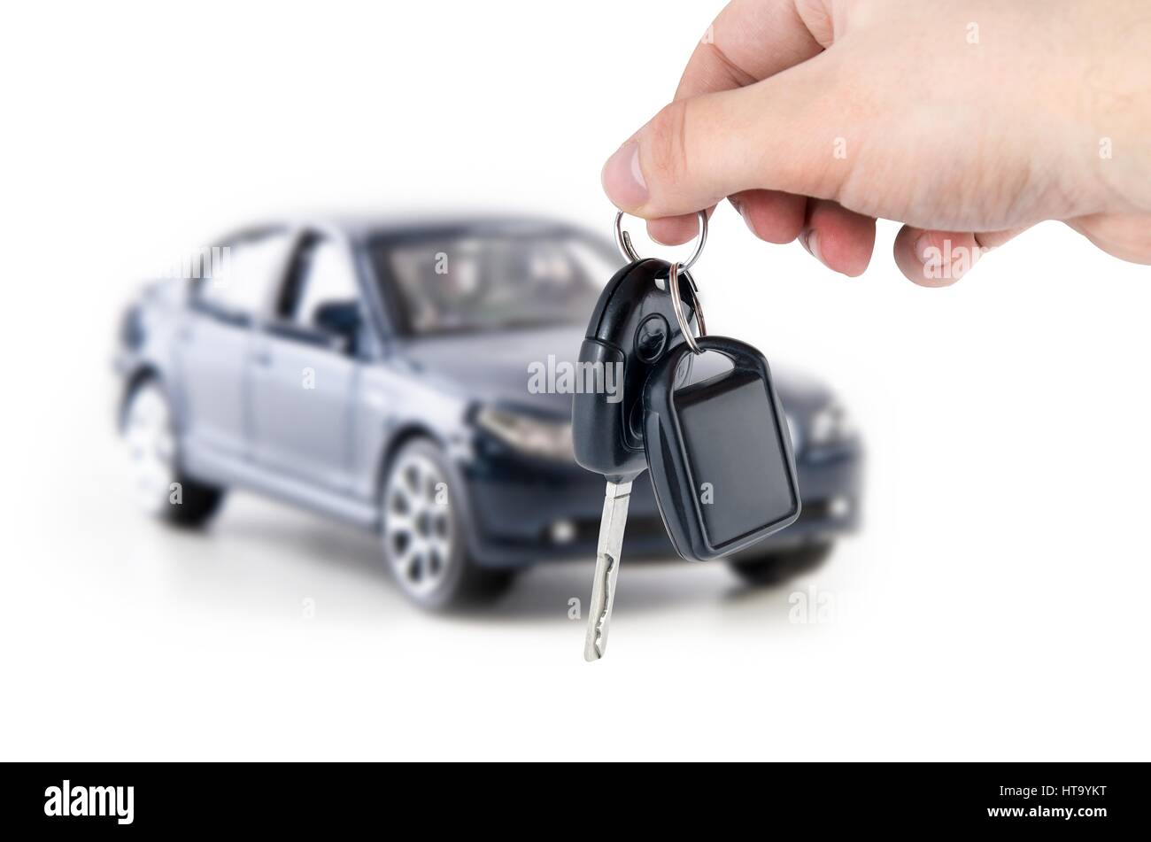 Hand holding keys to new car. Buy or selling business composition Stock Photo