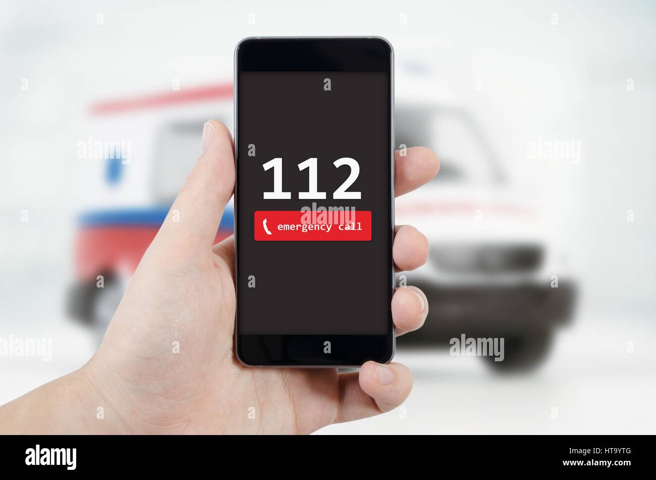 Man calling emergency. Ambulance in background. emergency call 112 aid man concept Stock Photo