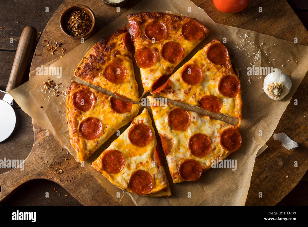 Cheap Greasy Frozen Pepperoni Pizza Ready to Eat Stock Photo Alamy