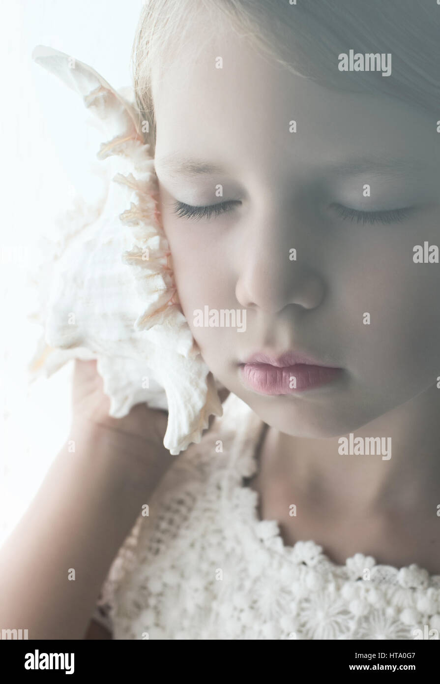 Child shell ear hi-res stock photography and images - Alamy