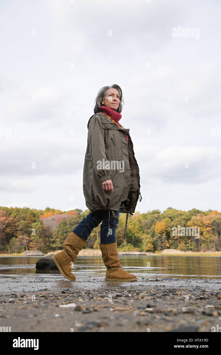Senior woman hiking alone water hi-res stock photography and images - Alamy