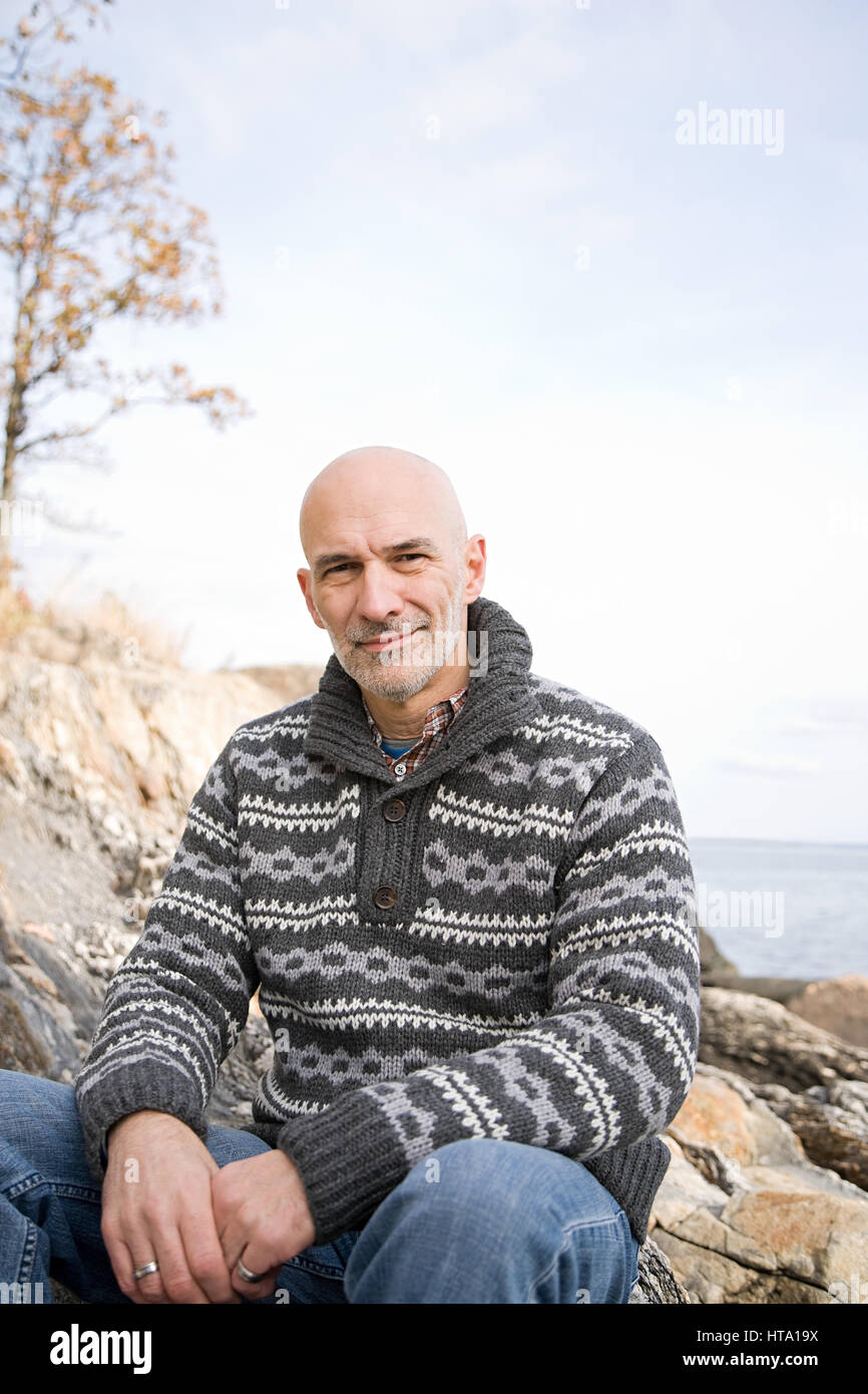 Portrait of senior man sitting on rock hi-res stock photography and ...