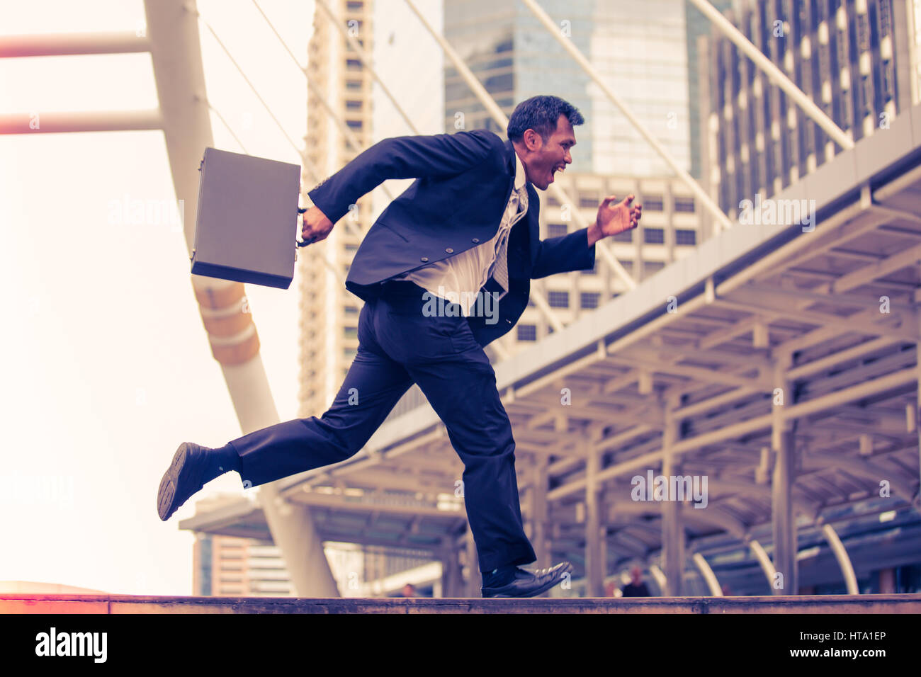 Man in suit briefcase running hires stock photography and images Alamy