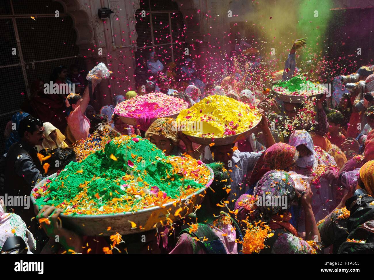 Mathura, Uttar Pradesh, India. 9th Mar, 2017. Mathura Devotee throw flower petals and colour