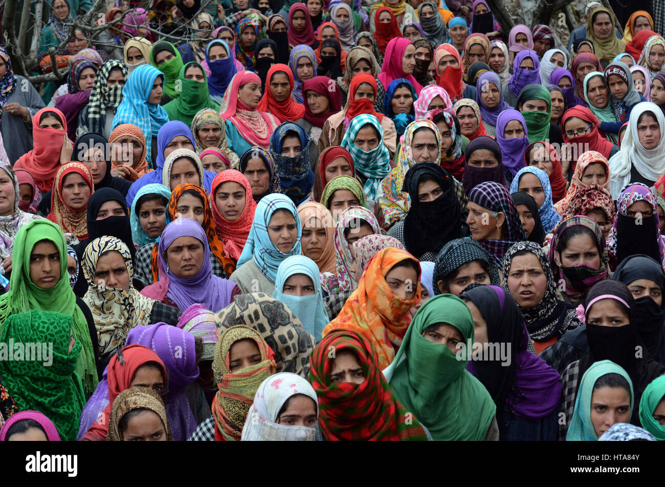 Srinagar, Kashmir. 9th Mar, 2017. Kashmiri villagers watching the funeral procession of a 15-year-old civilian Amir Nazir. during his funeral, two militants and two civilians killed in the encounter in Padgampora area of Jammu and Kashmir’s Pulwama district.This is the first civilian casualty since Army chief General Bipin Rawat warned civilians to stay away from encounter sites, saying those involved in stone-pelting on forces during gun battles with militants will not be dealt differently. Credit: sofi suhail/Alamy Live News Stock Photo