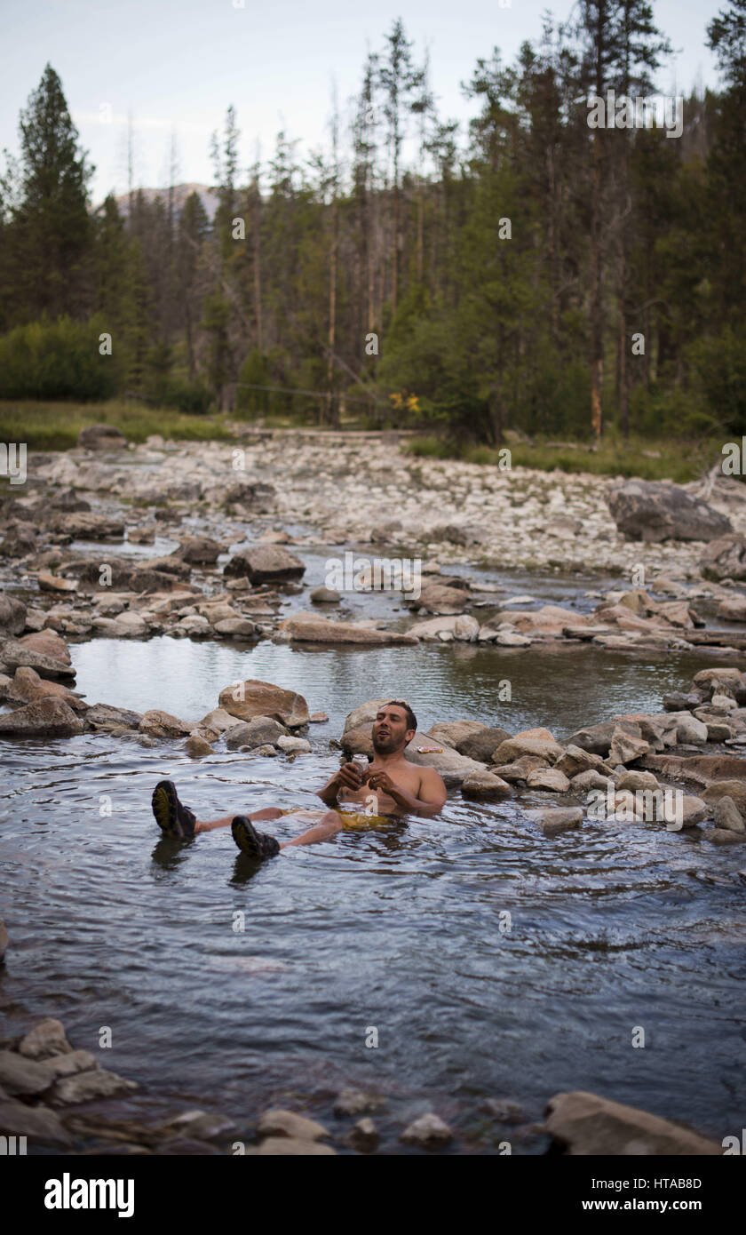 July 30, 2013 Idaho, USA Hot spring session with bikini and board