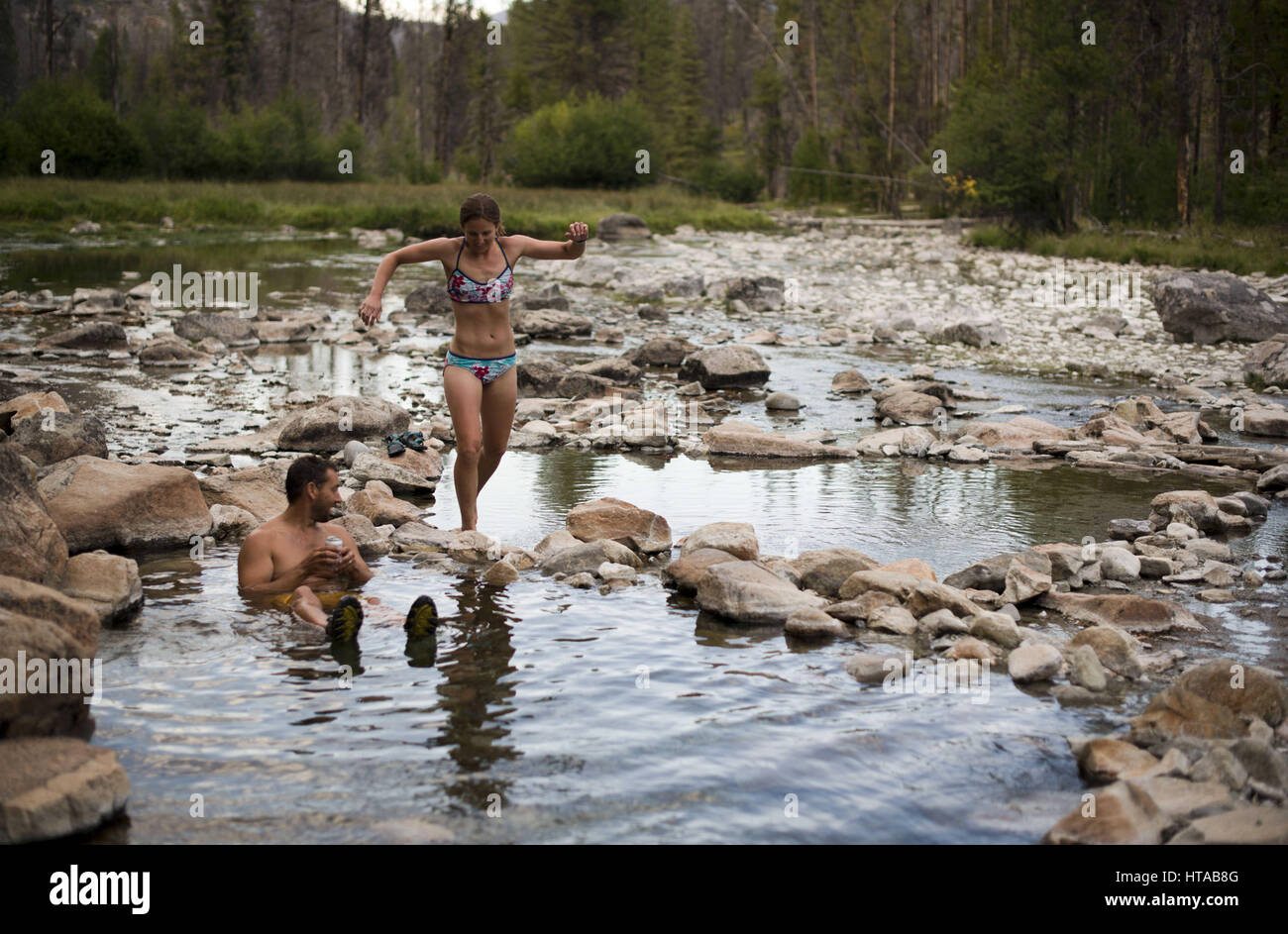 July 30, 2013 Idaho, USA Hot spring session with bikini and board