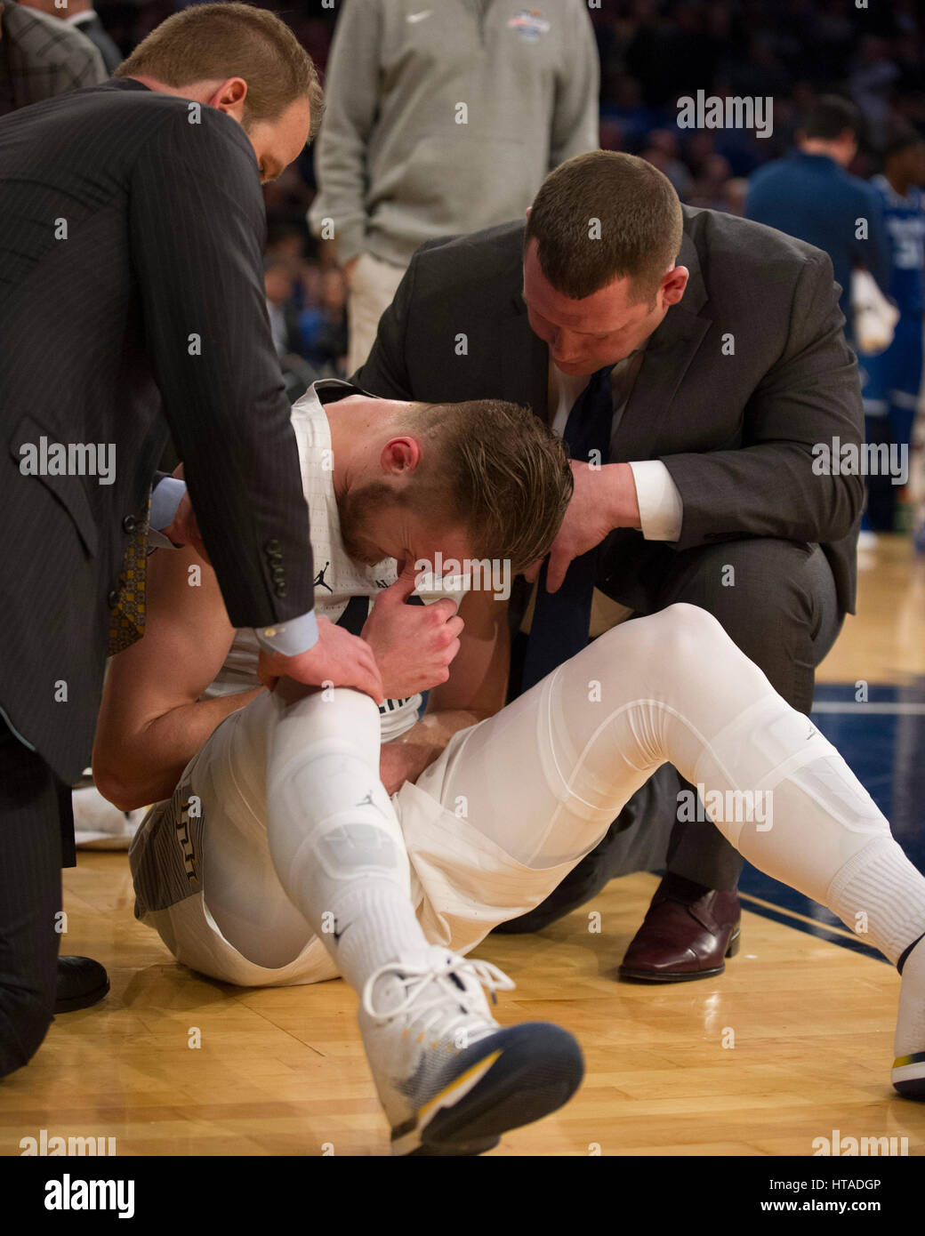 Madison Square Garden, New York, New York, USA. 09th Mar, 2017. Marquette Golden Eagles center Luke Fischer (40) is attended to after being injured at The 35th Big East Tournament during the game between The Seton Hall Pirates and The Marquette Golden Eagles at Madison Square Garden, New York, New York. The Seton Hall Pirates defeat The Marquette Golden Eagles 82-76. Mandatory credit: Kostas Lymperopoulos/CSM/Alamy Live News Stock Photo