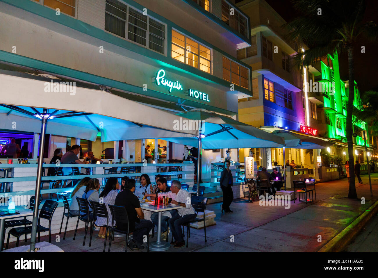 Miami Beach Florida,Ocean Drive,Art Deco Historic District,Penguin Hotel,sign,restaurant restaurants food dining cafe cafes,sidewalk cafe,al fresco si Stock Photo