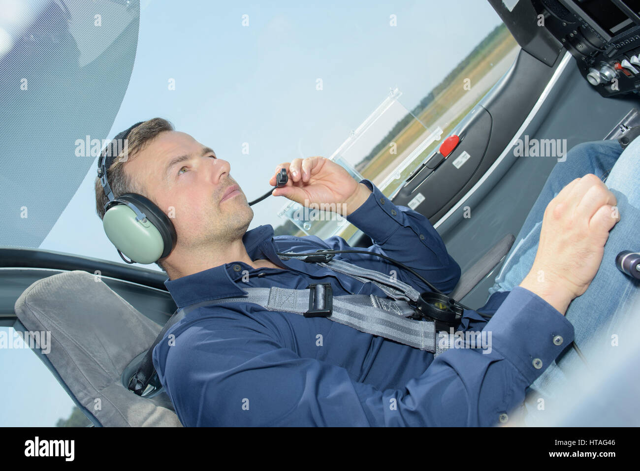 Pilot wearing headset with microphone Stock Photo