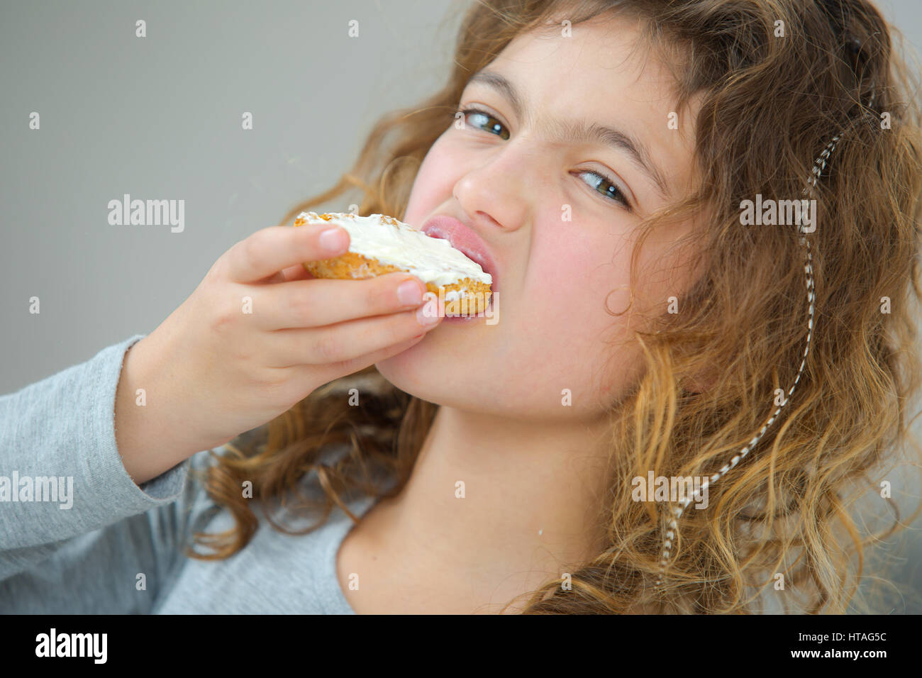 Little girl eating bread Stock Photo