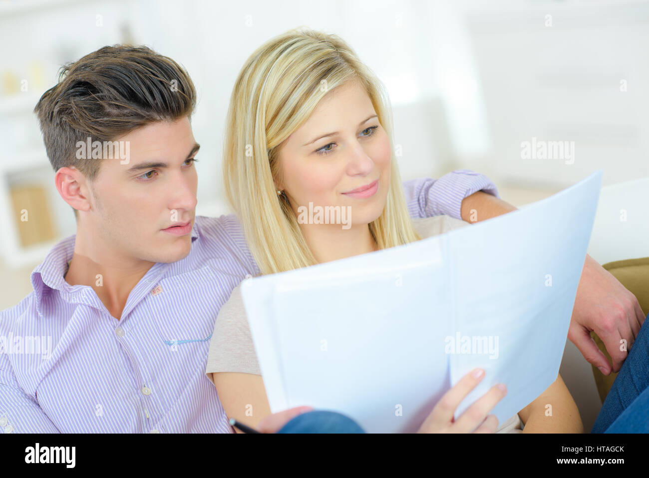 Couple Reading Through An Important Document Stock Photo Alamy