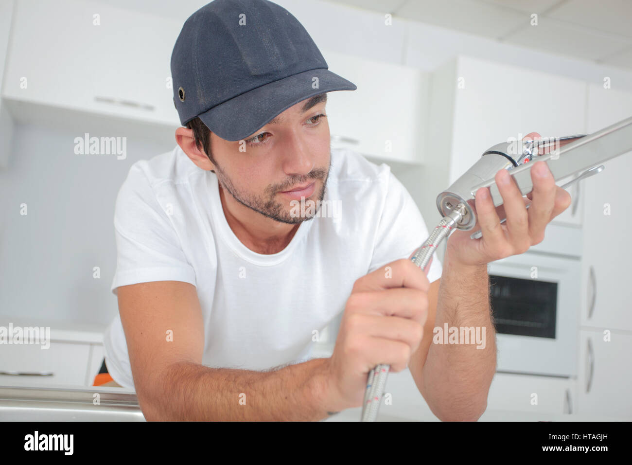 plumber doing some fittings Stock Photo