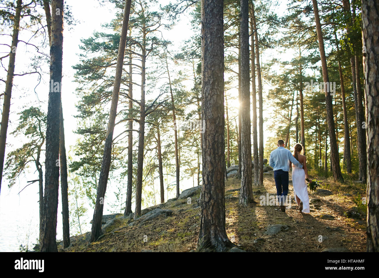 Woman walking down forest path hi-res stock photography and images - Alamy