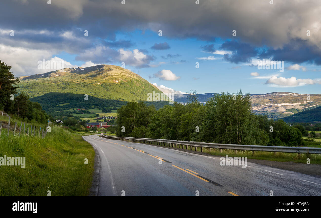 Auto trip at Norwegian rural roads and villages under the mountains. Norway landscapes. Stock Photo