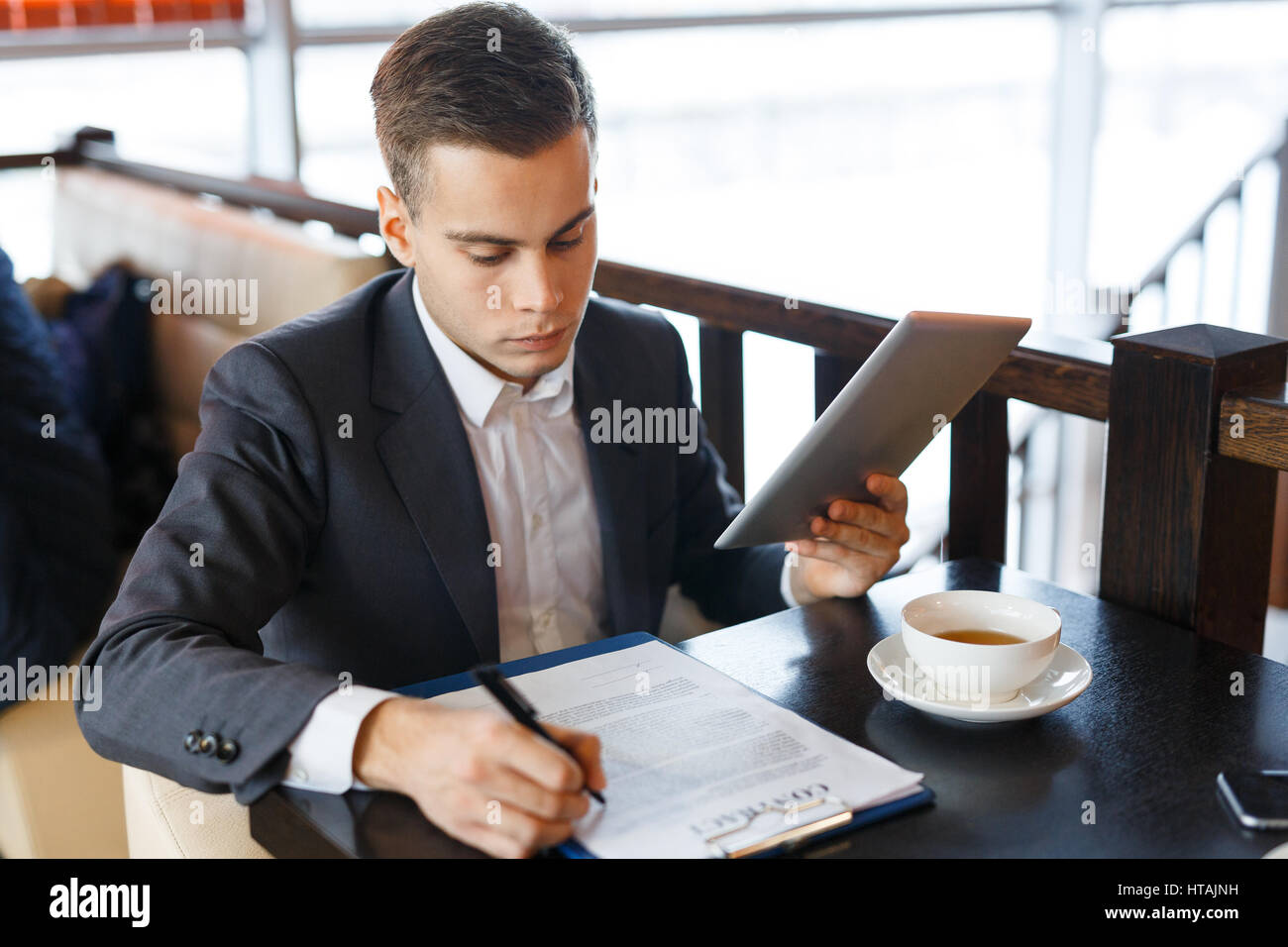 Reading before signing hi-res stock photography and images - Alamy
