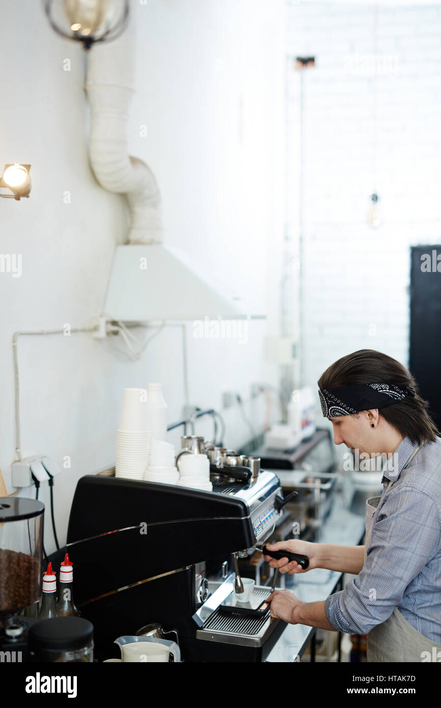 Professional barista using coffeemachine at work Stock Photo Alamy