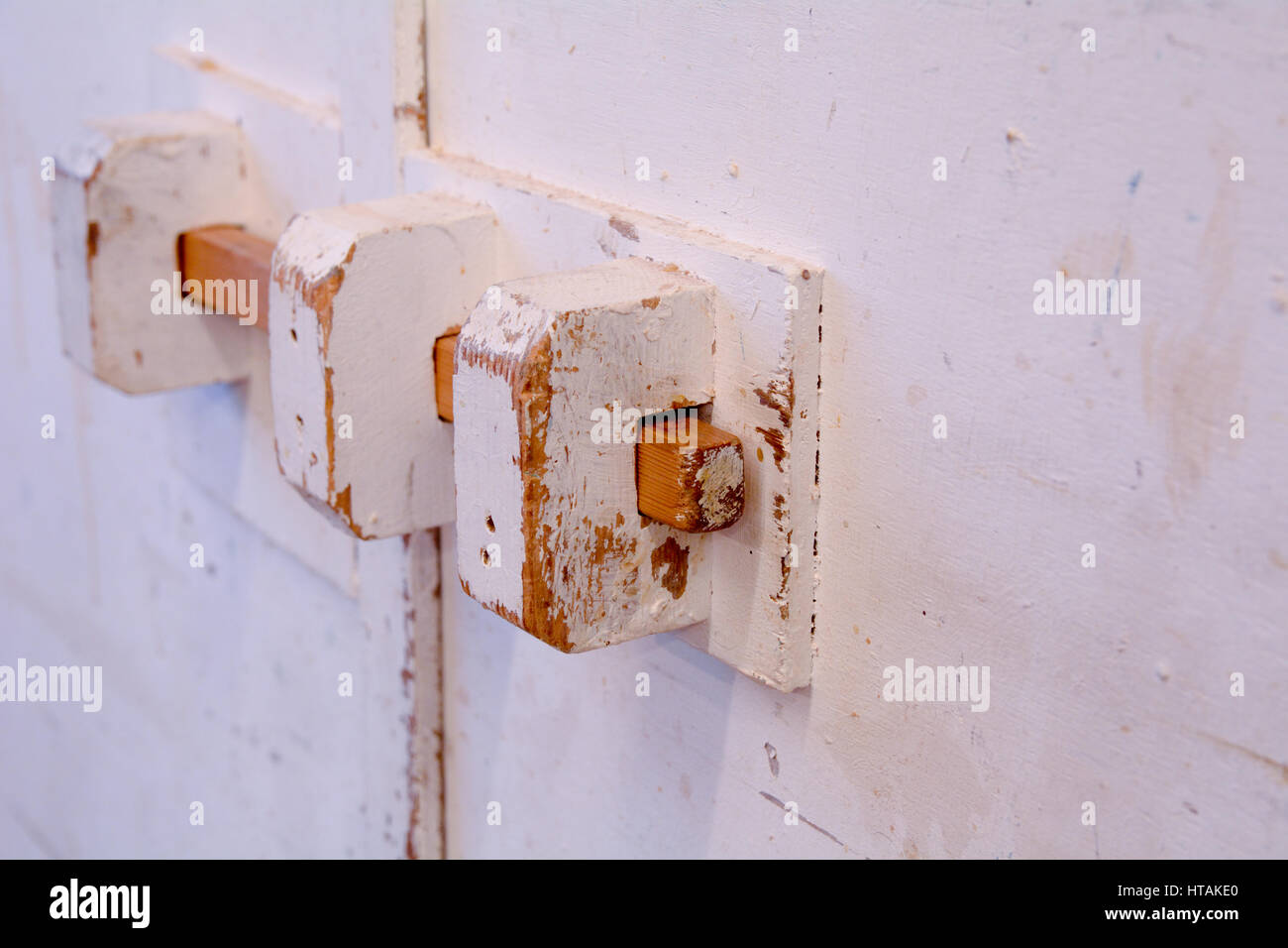 Hand made wooden cupboard door and lock in carpneters workshop Stock Photo