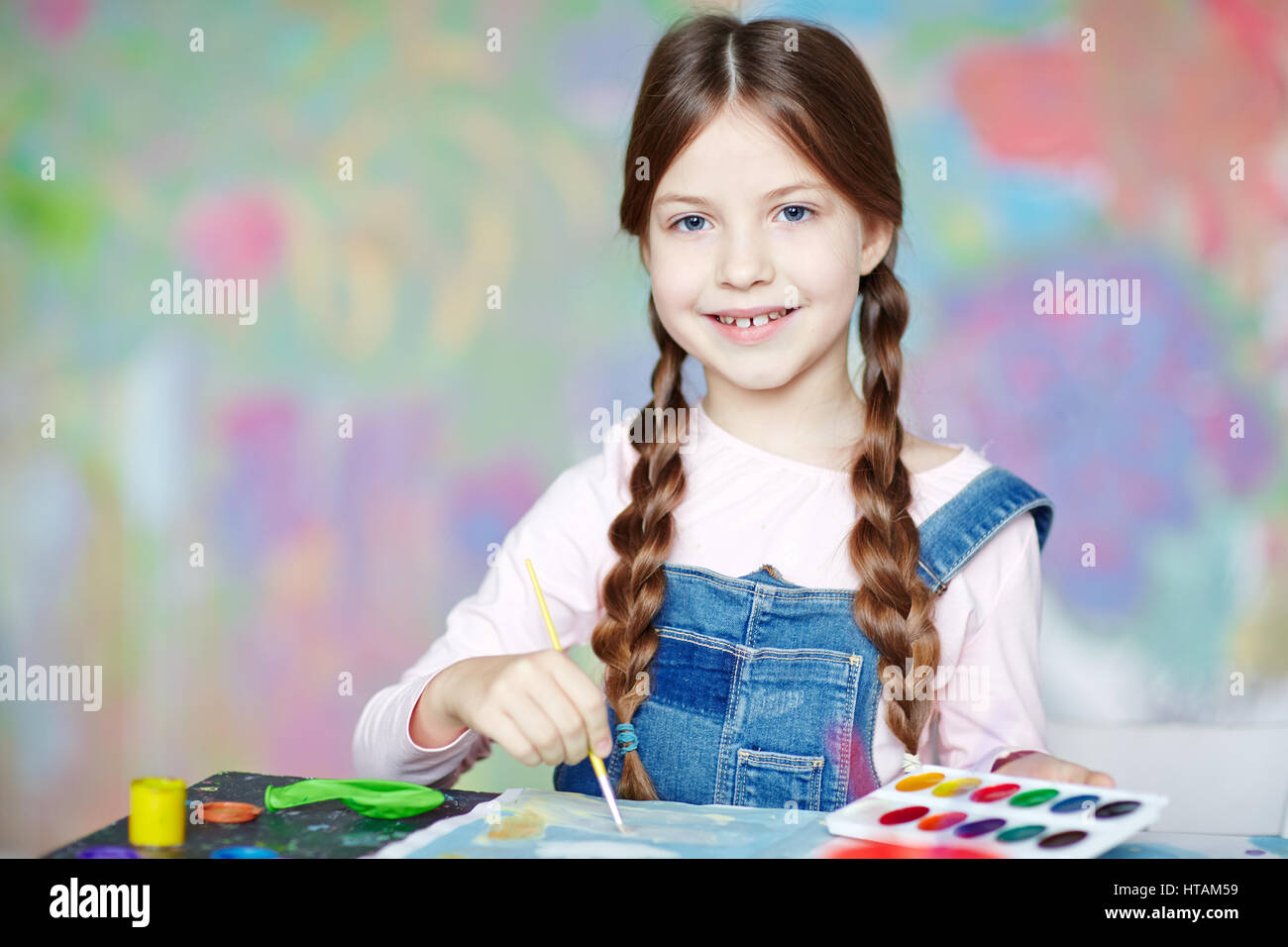 Girl with pigtails painting hi-res stock photography and images - Alamy.