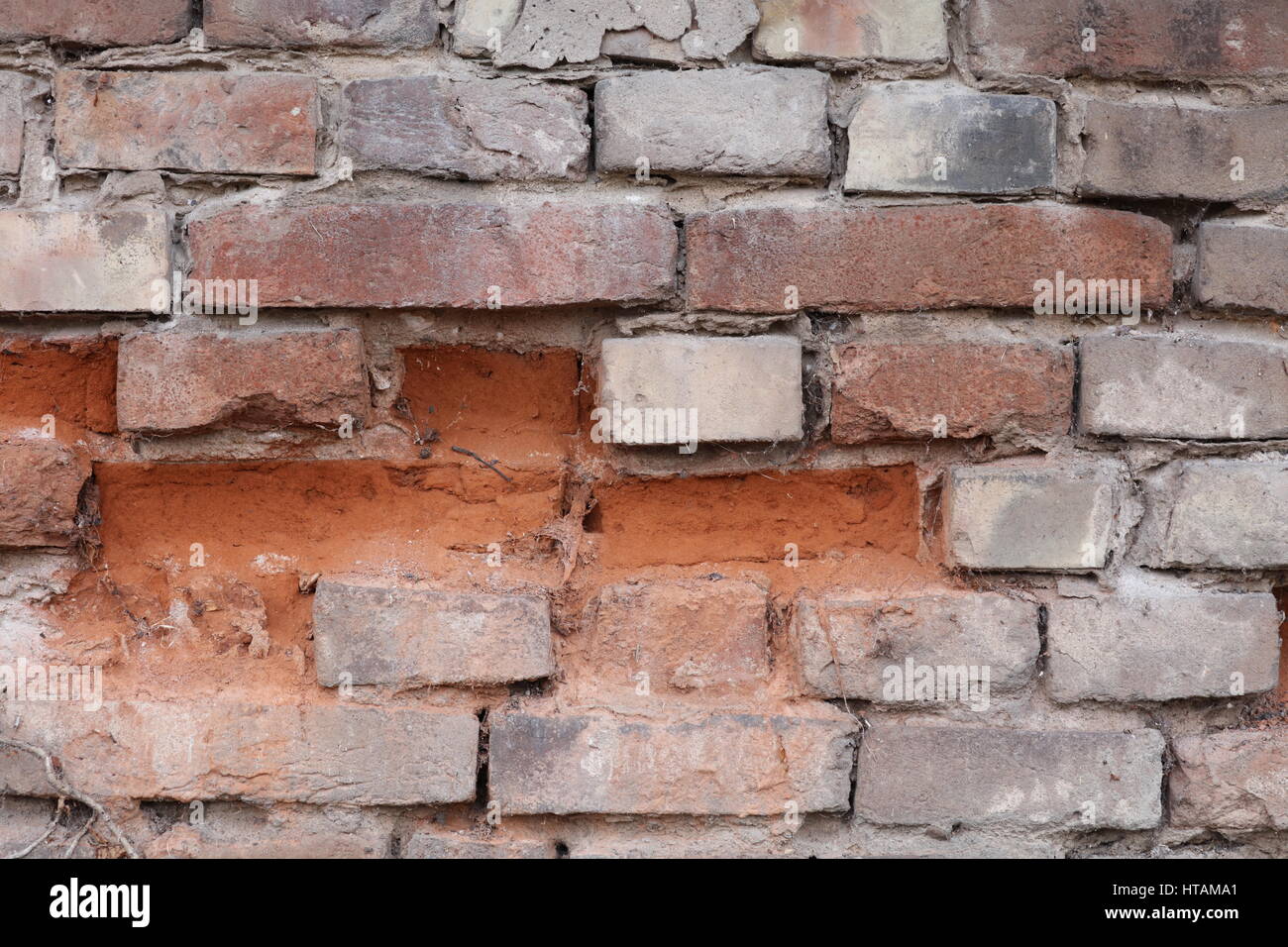 Natursteinmauer mit rotem Sandstein Stock Photo