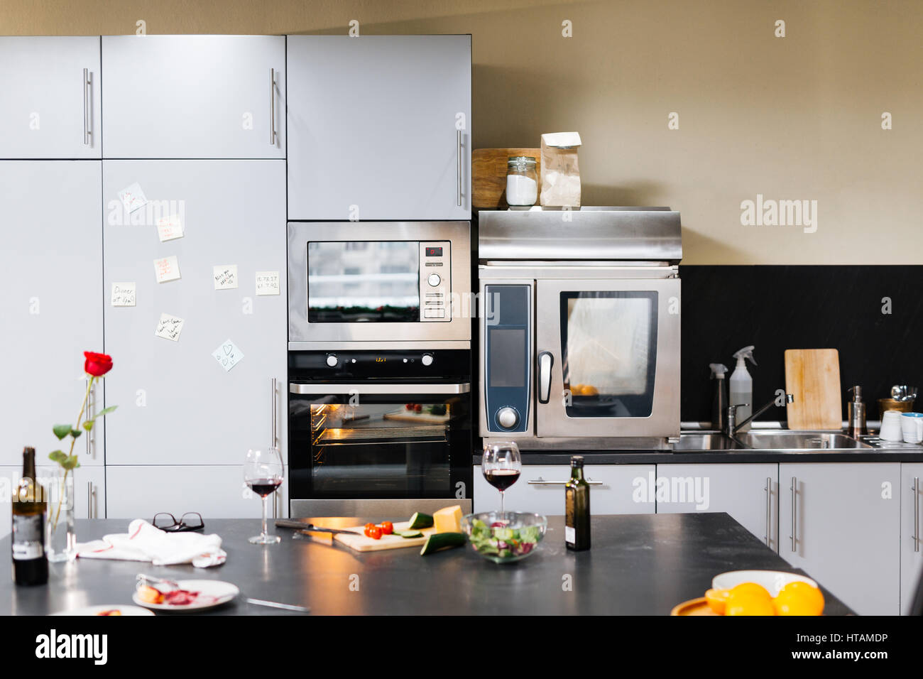 Empty kitchen with home appliances and food Stock Photo - Alamy