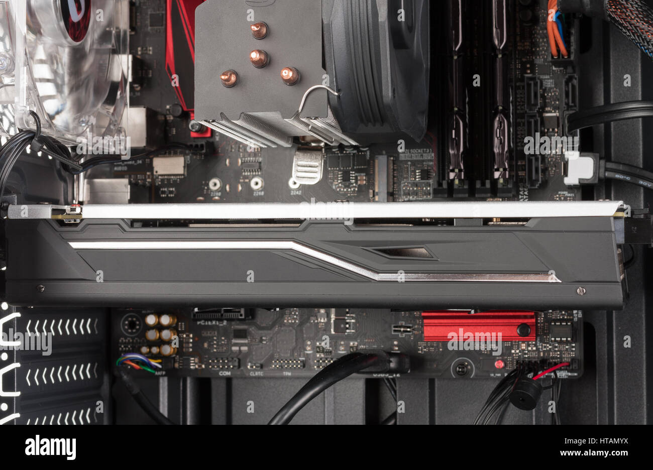 Close up of graphics card in PCIe slot on ATX motherboard on open