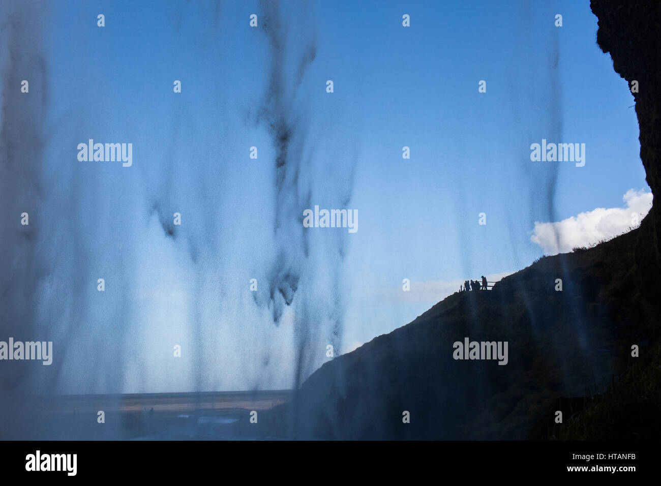 Cascade of water falling from cliff Stock Photo - Alamy